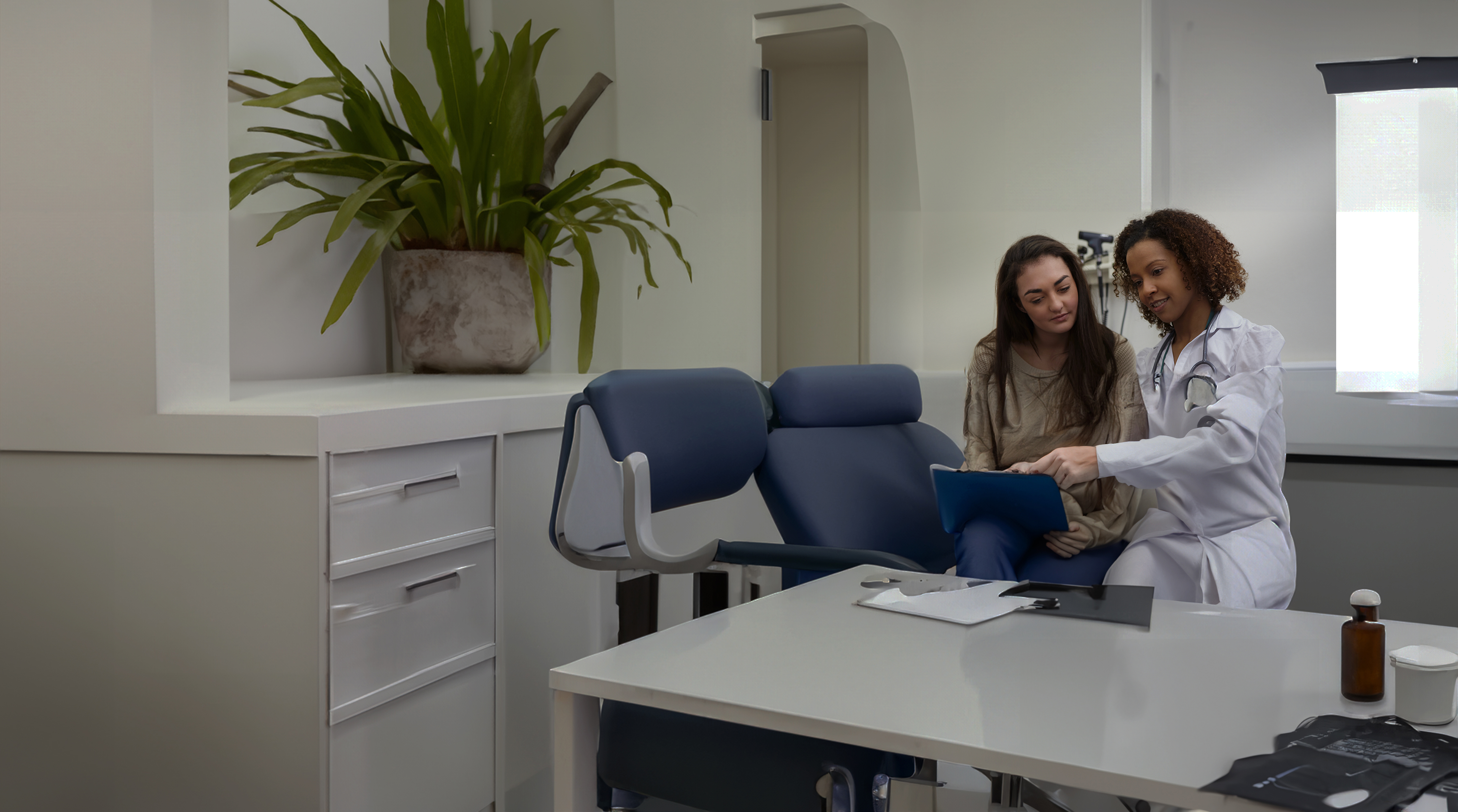 healthcare provider with patient in office